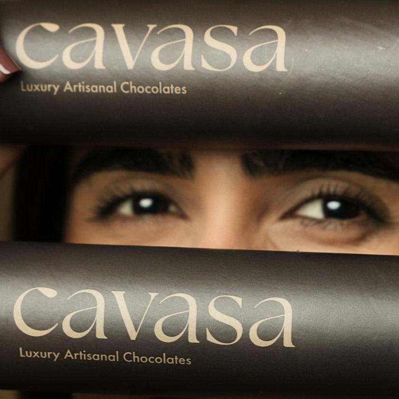 Woman holding a Cavasa dragée tube – Luxury Artisanal Chocolates