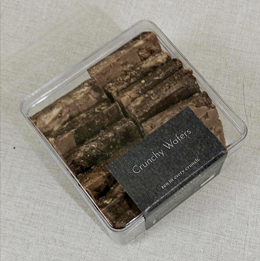 Box of Crunchy Wafers on a textured beige background